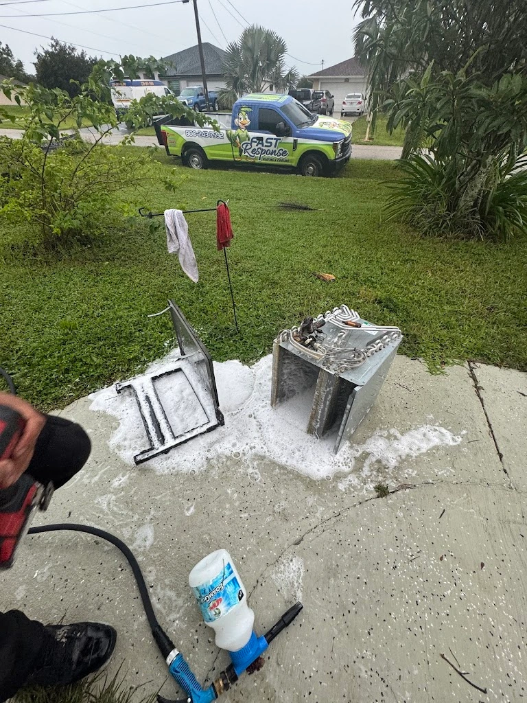 Fast Response technician inspecting a residential York condenser unit at a Cape Coral home
