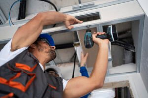 low-angle-people-working-with-drill-scaled-2.jpg
